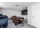 Cozy basement with a large TV, comfortable seating, and ample space for relaxation at 1102 N Newman St, Indianapolis, IN 46201