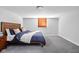Comfortable bedroom with a queen bed, plush carpeting, and a warm, inviting atmosphere at 1102 N Newman St, Indianapolis, IN 46201