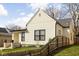 Charming home with black trim windows, fresh lawn, and wooden fence at 1102 N Newman St, Indianapolis, IN 46201