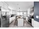 Bright, updated kitchen featuring white cabinets, stainless steel appliances, and an island at 1102 N Newman St, Indianapolis, IN 46201