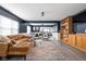 Open living room with blue walls, open floor plan, and an ornate area rug at 1102 N Newman St, Indianapolis, IN 46201