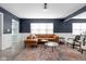 Cozy living room with blue walls, stylish furniture, and an ornate area rug at 1102 N Newman St, Indianapolis, IN 46201