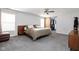 Spacious main bedroom with a walk-in closet, ceiling fan, and neutral tones at 1102 N Newman St, Indianapolis, IN 46201