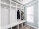 Mud room features white cubbies, storage, and bench at 1102 N Newman St, Indianapolis, IN 46201