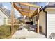 Cozy backyard patio with outdoor seating and a wooden pergola, perfect for entertaining at 1102 N Newman St, Indianapolis, IN 46201