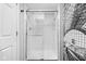 Modern walk-in shower with subway tile and glass door at 1102 N Newman St, Indianapolis, IN 46201