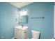 Updated bathroom with a white vanity and light blue walls at 1130 W 33Rd St, Indianapolis, IN 46208