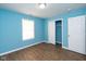 Well-lit bedroom with light blue walls and wood flooring at 1130 W 33Rd St, Indianapolis, IN 46208