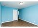 Light blue bedroom with wood floors at 1130 W 33Rd St, Indianapolis, IN 46208