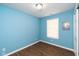 Simple bedroom with light blue walls and wood flooring at 1130 W 33Rd St, Indianapolis, IN 46208