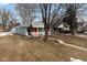 Gray house with red door and porch, steps leading to the entrance at 1130 W 33Rd St, Indianapolis, IN 46208