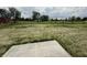 Expansive backyard featuring a lush lawn, mature trees, and ample space for outdoor activities at 116 Marble Wood Dr, Danville, IN 46122