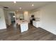Bright, open kitchen featuring an island, stainless steel appliances, and modern countertops at 116 Marble Wood Dr, Danville, IN 46122