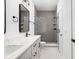 Modern bathroom with double vanity, large mirror, and shower at 1234 Alabama St, Indianapolis, IN 46202
