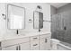 Modern bathroom with double vanity, large mirror, and shower at 1234 Alabama St, Indianapolis, IN 46202