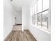 Bright landing with stairs leading upstairs and large window at 1234 Alabama St, Indianapolis, IN 46202