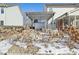 The Backyard features a snow covered pergola, raised flowerbeds and stone features at 14928 Declaration Dr, Westfield, IN 46074