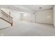 View of the spacious unfinished basement area with stairs and access door at 14928 Declaration Dr, Westfield, IN 46074