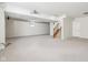 Spacious finished basement with plush carpeting, stairs, and a neutral color palette at 14928 Declaration Dr, Westfield, IN 46074