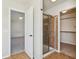 Bathroom with tile floor, glass shower door, and access to a large bedroom and walk-in closet at 14928 Declaration Dr, Westfield, IN 46074