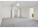 A primary bedroom suite with vaulted ceilings, neutral carpet and doorway leading to a bathroom at 14928 Declaration Dr, Westfield, IN 46074