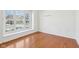 Bedroom with hardwood floors and window with a view of the street at 14928 Declaration Dr, Westfield, IN 46074