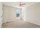 Carpeted bedroom featuring a ceiling fan, white walls, and a bright window at 14928 Declaration Dr, Westfield, IN 46074