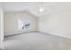 A large bedroom with vaulted ceilings, neutral carpet and a window providing natural light at 14928 Declaration Dr, Westfield, IN 46074