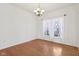 A bright dining room with hardwood floors, a chandelier, and a window dressed with sheer curtains at 14928 Declaration Dr, Westfield, IN 46074
