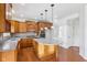 Kitchen features stainless appliances, an island with seating, and ample cabinet space at 14928 Declaration Dr, Westfield, IN 46074