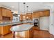 Kitchen features stainless appliances, an island with seating, and ample cabinet space at 14928 Declaration Dr, Westfield, IN 46074