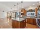 Kitchen with island, stainless appliances, tile backsplash and open floor plan at 14928 Declaration Dr, Westfield, IN 46074