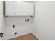 Laundry room with storage cabinets, tile floor, and washer and dryer hookups at 14928 Declaration Dr, Westfield, IN 46074