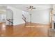 Inviting living room featuring hardwood floors, a fireplace, a staircase, and ample natural light at 14928 Declaration Dr, Westfield, IN 46074