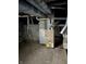 Unfinished basement with furnace and pipes at 239 Iowa St, Indianapolis, IN 46225