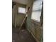 A fixer-upper kitchen needing renovation. Walls and floors are damaged at 239 Iowa St, Indianapolis, IN 46225