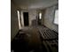 Large living area with exposed walls and debris at 239 Iowa St, Indianapolis, IN 46225