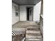 Small wooden deck with open door and simple railing at 243 E Caven St, Indianapolis, IN 46225