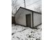 View of a white detached garage with a brown door at 243 E Caven St, Indianapolis, IN 46225