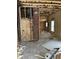 Under construction interior with exposed framing and insulation at 243 E Caven St, Indianapolis, IN 46225