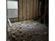 Room under renovation with exposed walls and debris on the floor at 243 E Caven St, Indianapolis, IN 46225