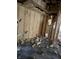 Damaged interior walls and floor requiring extensive renovations at 243 E Caven St, Indianapolis, IN 46225