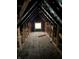 Spacious unfinished attic with window; ideal for conversion at 243 E Caven St, Indianapolis, IN 46225