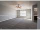 Bright and airy main bedroom with window and ceiling fan at 5619 Beale St, Plainfield, IN 46168