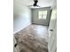 Bright bedroom with hardwood floors and ceiling fan at 5619 Pappas Dr, Indianapolis, IN 46237