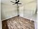 Well-lit bedroom, featuring hardwood floors and ceiling fan at 5619 Pappas Dr, Indianapolis, IN 46237