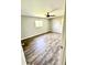 Spacious main bedroom with hardwood floors and large windows at 5619 Pappas Dr, Indianapolis, IN 46237