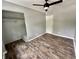 Spacious bedroom with ceiling fan and hardwood floors at 5619 Pappas Dr, Indianapolis, IN 46237