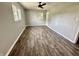 Bright bedroom featuring hardwood floors and large windows at 5619 Pappas Dr, Indianapolis, IN 46237