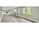Bright dining area with wood-look floors and view into kitchen at 5619 Pappas Dr, Indianapolis, IN 46237